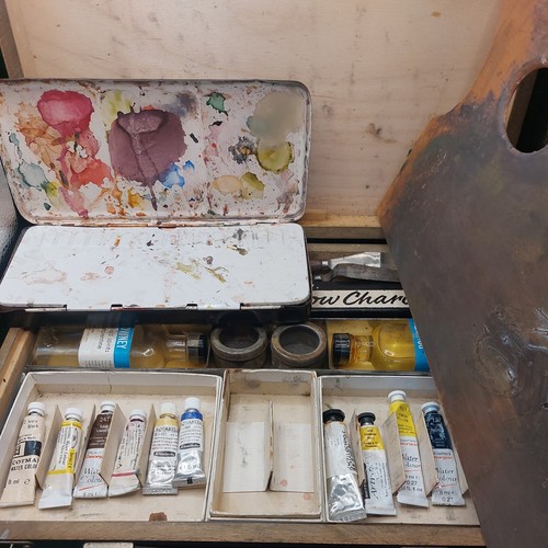 Artist paints and - and, case